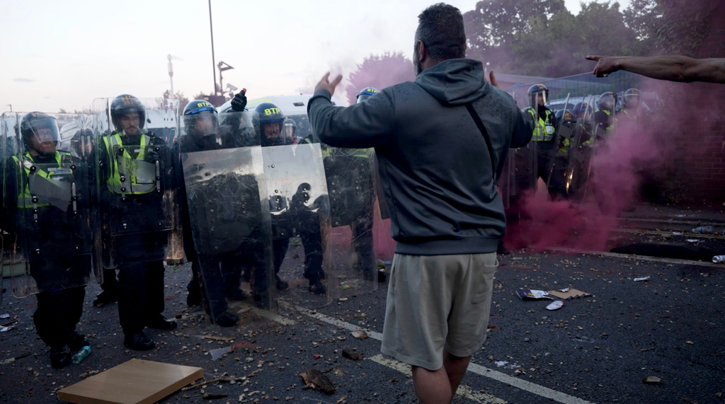 In this image taken from PA Video, police and protestors clash during a protest following the death of Henry Nowak, a 18-year-old student stabbed to death with a Sikh kirpan ceremonial by Vickrum Digwa, in Southampton, England, Tuesday June 2, 2026. (Jamie Lashmar/PA via AP)