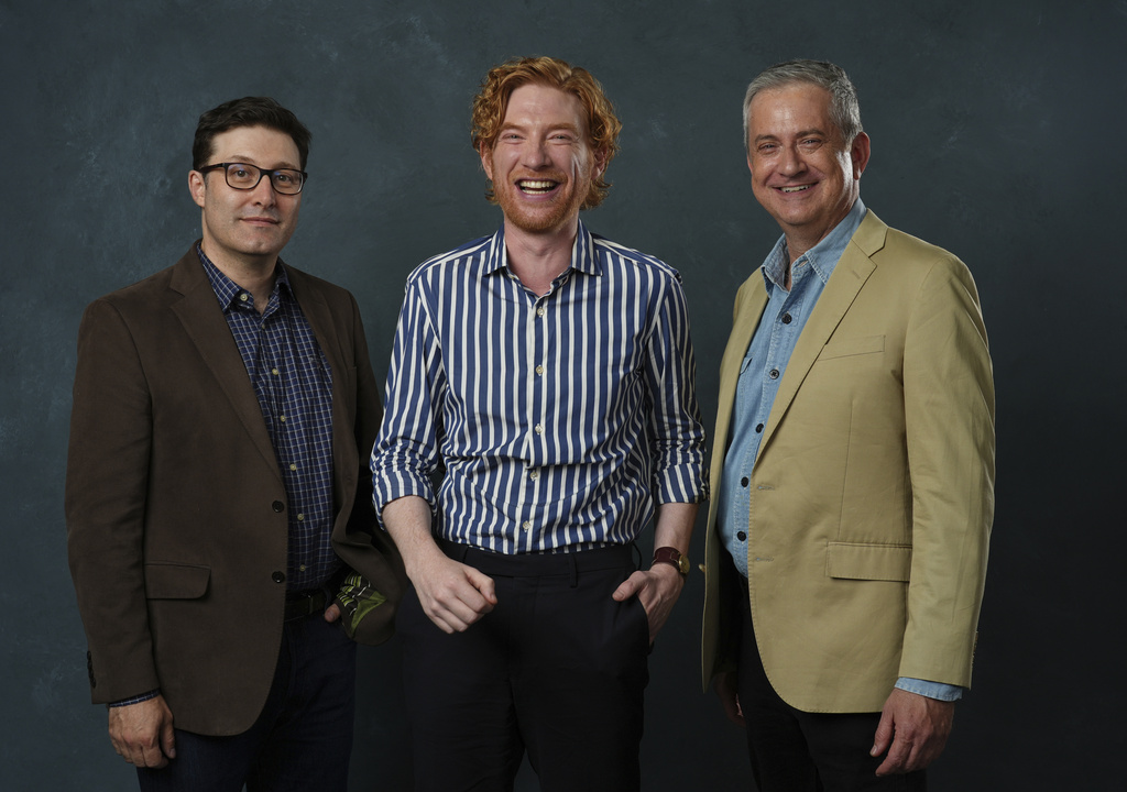 Domhnall Gleeson, center, poses for a portrait with "The Paper" co-creators Greg Daniels, left, and Michael Koman on Tuesday, Aug. 26, 2025, in West Hollywood, Calif. (AP Photo/Chris Pizzello)