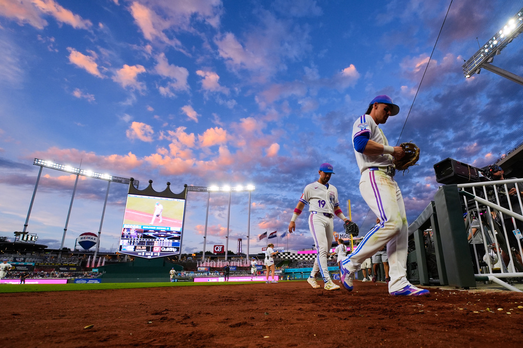 FILE - Kansas City Royals second baseman Michael Massey (19) and shortstop Bobby Witt Jr., right, return to the dugout during the fourth inning of a baseball game against the Houston Astros, Friday, June 12, 2026, in Kansas City, Mo. (AP Photo/Charlie Riedel, File)