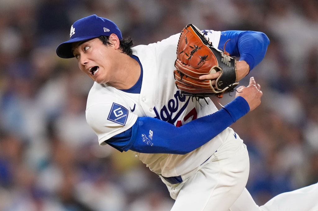 Los Angeles Dodgers starting pitcher Shohei Ohtani throws to the plate during the sixth inning of a baseball game against the San Diego Padres, Friday, July 3, 2026, in Los Angeles. (AP Photo/Mark J. Terrill)