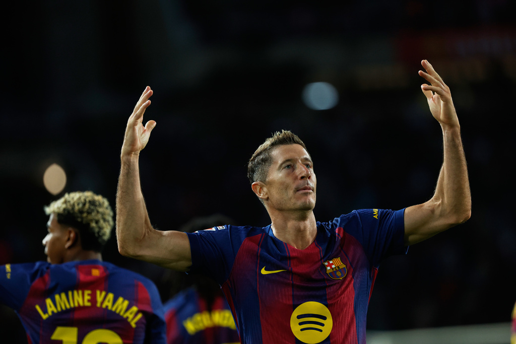 Barcelona's Robert Lewandowski celebrates scoring his side's 2nd goal during a Spanish La Liga soccer match between FC Barcelona and Real Sociedad at the Lluis Companys Olympic Stadium in Barcelona, Spain, Sunday, Sept. 28, 2025. (AP Photo/Joan Monfort)