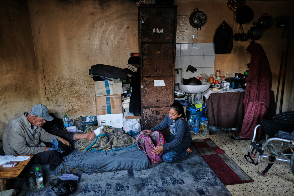 Eleven-year-old Ghazal al-Kibritti, who lost her parents and three siblings in an Israeli airstrike, prepares her school bag at her grandparents' home in Gaza City, Sunday, April 26, 2026. (AP Photo/Jehad Alshrafi)