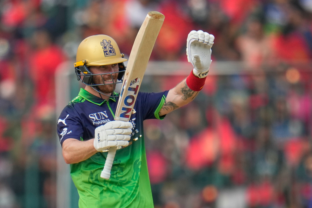 Royal Challengers Bengaluru's Phil Salt celebrates his fifty runs during the Indian Premier League cricket match between Royal Challengers Bengaluru and Delhi Capitals in Bengaluru, India, Saturday, April 18, 2026. (AP Photo/Aijaz Rahi)