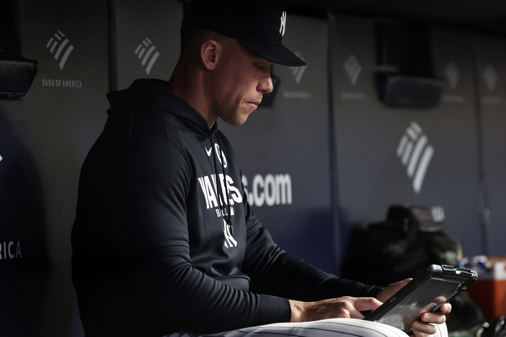 New York Yankees right fielder Aaron Judge (99) looks on from the dugout during the seventh inning of a baseball game against the Cleveland Guardians, Tuesday, June 2, 2026, in New York. (AP Photo/Adam Hunger)