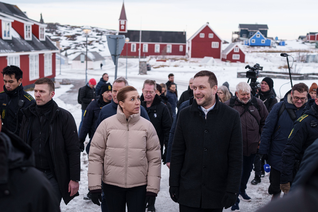 FILE - Prime Minister of Denmark Mette Frederiksen, centre left, and Greenlandic Prime Minister Jens-Frederik Nielsen walk in Nuuk, Greenland, Jan. 23, 2026. (AP Photo/Evgeniy Maloletka, File)