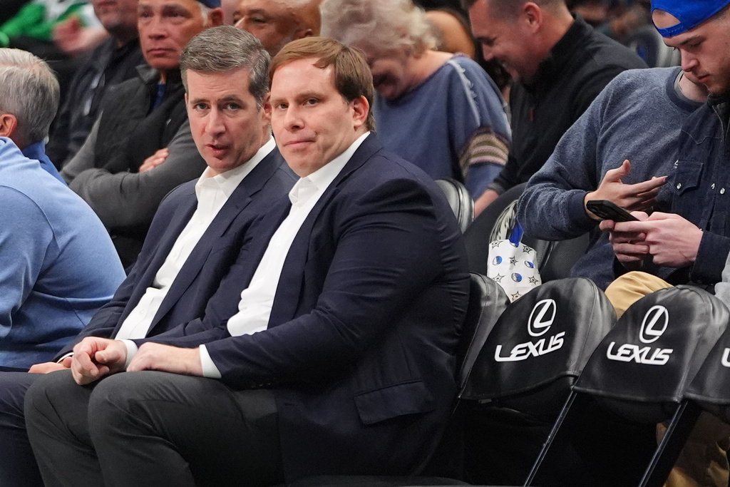 Dallas Mavericks governor Patrick Dumont, center, watches from the sideline seats during the second half of an NBA basketball game against the Milwaukee Bucks in Dallas, Monday, Nov. 10, 2025. (AP Photo/LM Otero)