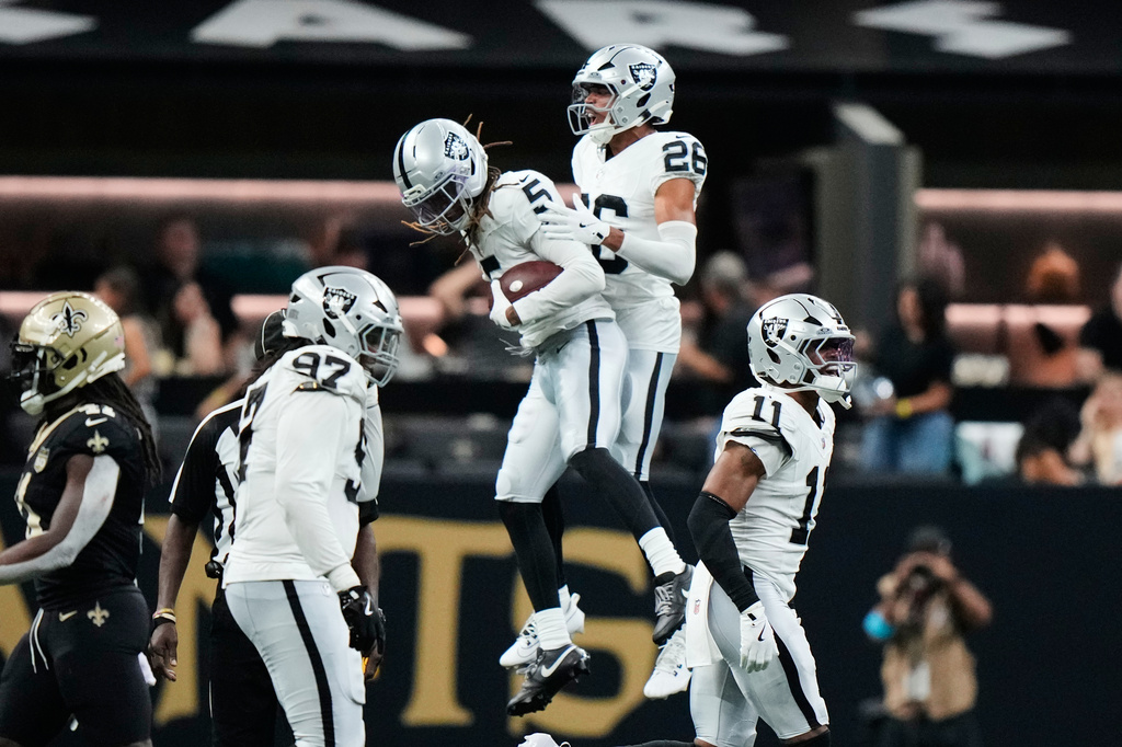 Las Vegas Raiders cornerback Eric Stokes (5) and Darien Porter (26) celebrate a New Orleans Saints fumble during the second half of an NFL football game in New Orleans, Sunday, Sept. 27, 2026. (AP Photo/Gerald Herbert)