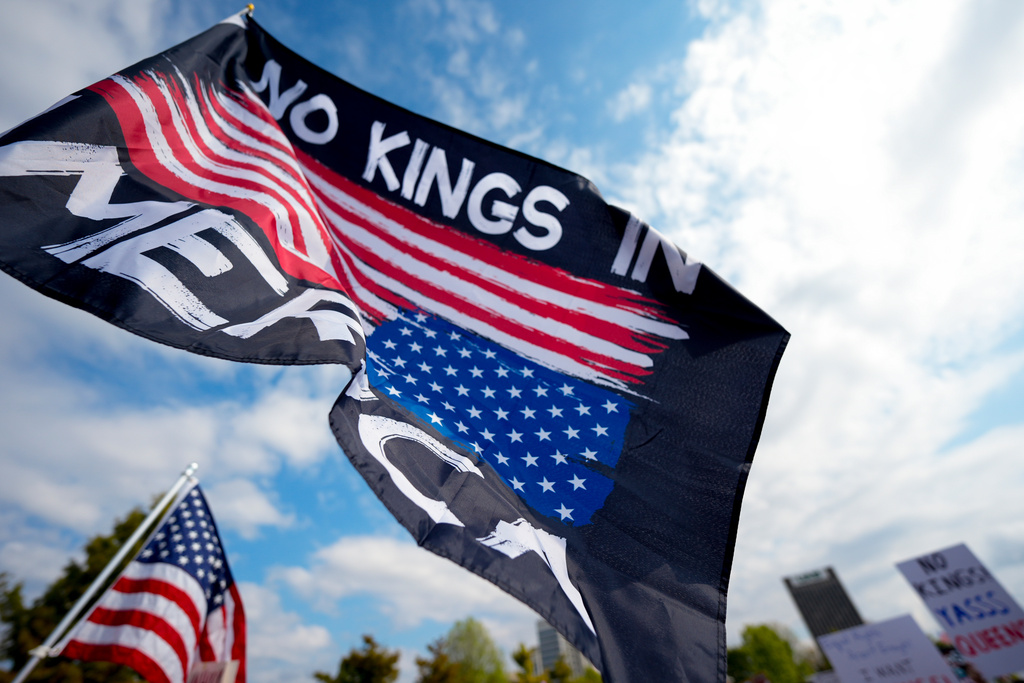 People participate in a "No Kings" rally, Saturday, Oct. 18, 2025, in Birmingham, Ala. (AP Photo/Mike Stewart)