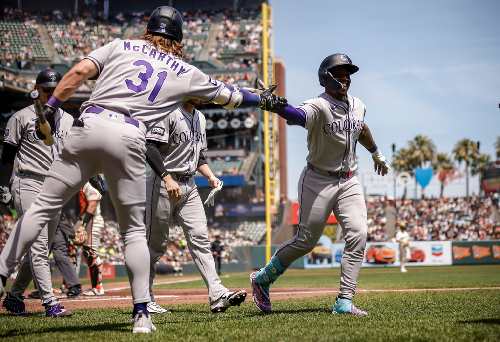 Colorado Rockies teammates congratulate Adael Amadodr (1) after his three-run home run in the first inning of a baseball game against the San Francisco Giants in San Francisco, Sunday, Aug. 16, 2026. (Carlos Avila Gonzalez/San Francisco Chronicle via AP)