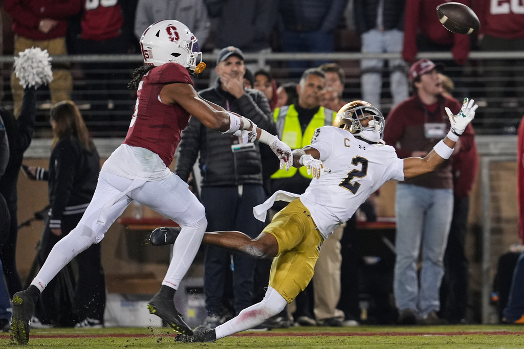 Notre Dame wide receiver Will Pauling (2) is unable to catch a pass in the end zone while defended by Stanford safety Jay Green (5) during the first half of an NCAA college football game, Saturday, Nov. 29, 2025, in Stanford, Calif. (AP Photo/Godofredo A. Vásquez)
