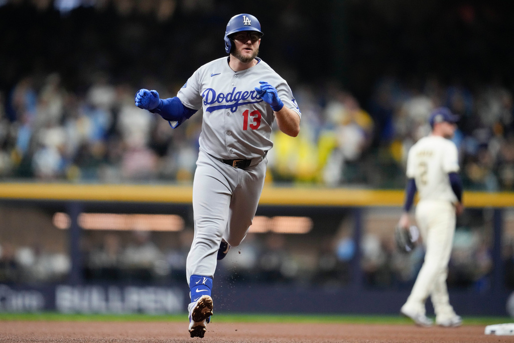 Los Angeles Dodgers' Max Muncy celebrates after a home run against the Milwaukee Brewers during the sixth inning in Game 2 of baseball's National League Championship Series, Tuesday, Oct. 14, 2025, in Milwaukee. (AP Photo/Ashley Landis)