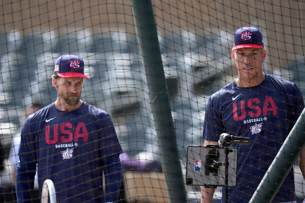United States' Bryce Harper, left, and Aaron Judge wait their turn during batting practice prior to an exhibition baseball game against the Colorado Rockies Wednesday, March 4, 2026, in Scottsdale, Ariz. (AP Photo/Ross D. Franklin)