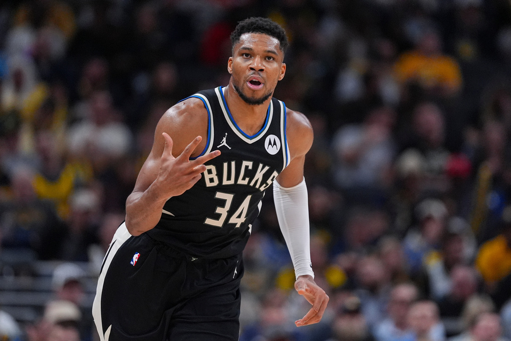 Milwaukee Bucks forward Giannis Antetokounmpo (34) reacts after a three-point basket against the Indiana Pacers during the second half of an NBA basketball game in Indianapolis, Monday, Nov. 3, 2025. (AP Photo/Michael Conroy)