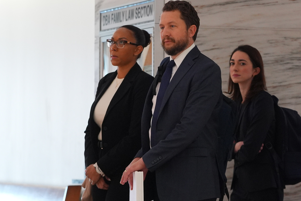 McKenna West, left, arrivers with her legal team for a court hearing in Dallas, Tuesday, Aug. 25, 2026. (AP Photo/LM Otero)
