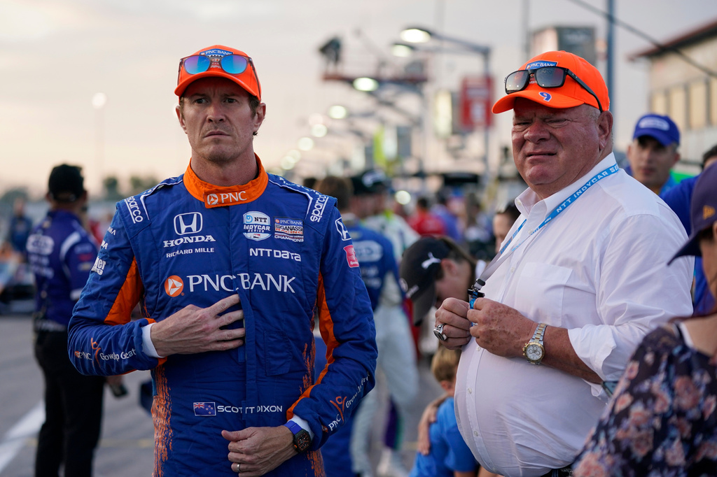 FILE - Scott Dixon, left, stands next to Chip Ganassi before the start an IndyCar auto race at World Wide Technology Raceway on Aug. 21, 2021, in Madison, Ill. (AP Photo/Jeff Roberson, File)