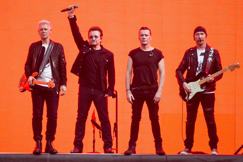 FILE - Adam Clayton, from left, Bono, Larry Mullen Jr. and The Edge, of the band U2, perform on stage at Twickenham Stadium in London on July 9, 2017. (Photo by Joel Ryan/Invision/AP, File)