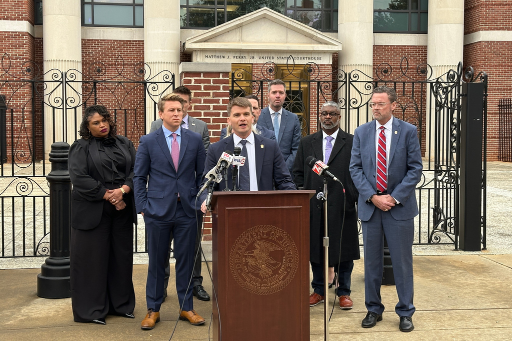 Federal prosecutors and agents who investigated former Republican South Carolina Rep. RJ May on charges he shared child sex abuse videos, hold a news conference outside the federal courthouse in Columbia, S.C. on Wednesday, Jan. 14, 2026, after May was sentenced to prison. (AP Photo/Jeffrey Collins)