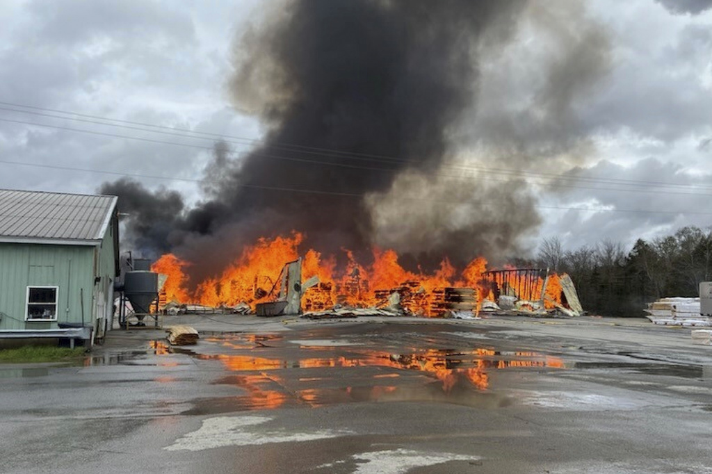 FILE - This photo provided by the Maine Department of Public Safety shows flames from a large fire at Robbins Lumber in Searsmont, Maine, May 15, 2026 (Maine Department of Public Safety via AP, File)