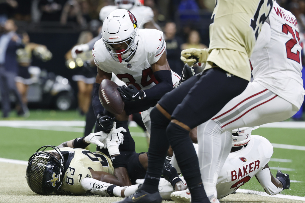 Arizona Cardinals safety Jalen Thompson (34) breaks up a pass intended for New Orleans Saints tight end Juwan Johnson (83) during the second half of an NFL football game Sunday, Sept. 7, 2025, in New Orleans. (AP Photo/Butch Dill)