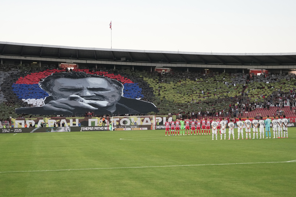 Players observe a minute of silence for former Bosnian Serb wartime general Ratko Mladic prior a Serbian National soccer league derby match between Red Star and Partizan in Belgrade, Serbia, Sunday, Sept. 6, 2026. (AP Photo/Darko Vojinovic)