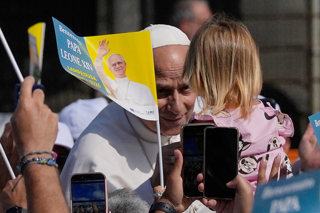 Pope Leo XIV arrives to celebrate Mass in Lampedusa, Sicily, southern Italy, Saturday, July 4, 2026, during a one-day pastoral visit to the Sicilian island that has come to symbolize the dramatic odyssey of migrants trying to reach Europe by sea. (AP Photo/Alessandra Tarantino)