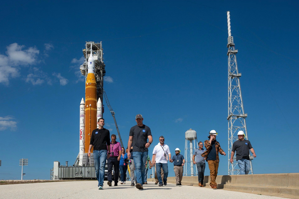 This image provided by NASA shows NASA Administrator Jared Isaacman, left, walking at the Kennedy Space Center launch pad in Cape Canaveral, Fla., Saturday, Feb. 21, 2026. (NASA via AP)