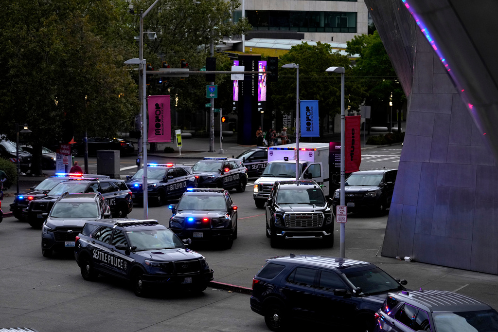 Seattle police respond to a shooting at Seattle Center during the Bite of Seattle food festival Sunday, July 26, 2026, in Seattle, Wash. (AP Photo/Lindsey Wasson)