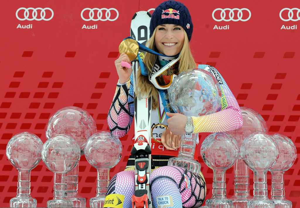 FILE - FILE - Lindsey Vonn, of the United States, poses with all the Olympic medals and Women's World Cup skiing trophies she has won in her career, on March 13, 2010, in Garmisch-Partenkirchen, Germany. (AP Photo/Giovanni Auletta, File)