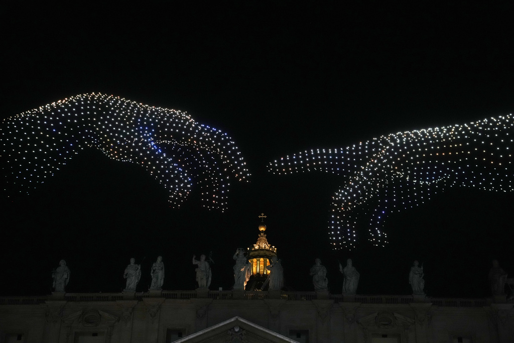 Drones compose light images over St. Peter basilica during a concert in St. Peter's Square for the conclusion of the World Meeting on Human Fraternity at the Vatican, Saturday, Sept. 13, 2025. (AP Photo/Gregorio Borgia)