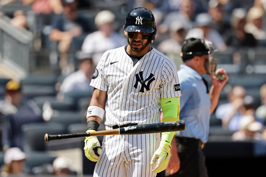 New York Yankees' José Caballero reacts after striking out during an at-bat where he was charged with a pitch-clock violation in the sixth inning during the first baseball game of a doubleheader against the Pittsburgh Pirates, Wednesday, July 22, 2026, in New York. (AP Photo/Adam Hunger)