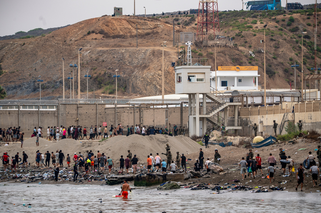 Migrants return to Morocco from the Spanish enclave of Ceuta, Friday, July 31, 2026. (AP Photo/Antonio Sempere)