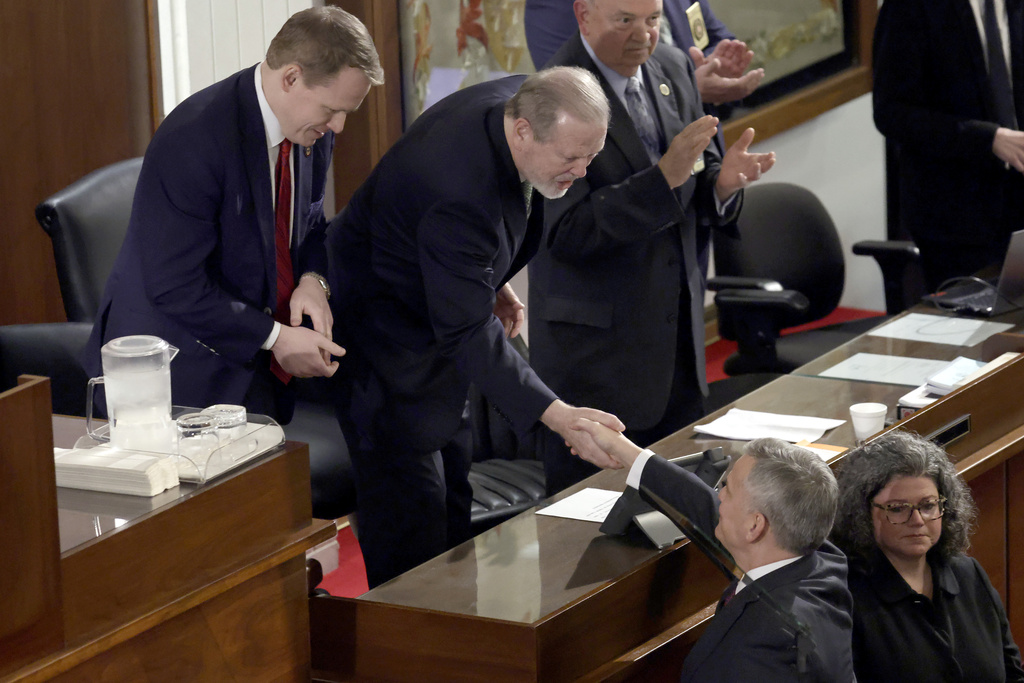 FILE - Speaker of the House Destin Hall, R-Caldwell, top left, and Senate leader Phil Berger, R-Rockingham, top center, greet North Carolina Gov. Josh Stein, bottom right, as he arrives to deliver the State of the State address at the Legislative Building, March 12, 2025, in Raleigh N.C. (AP Photo/Chris Seward, file)