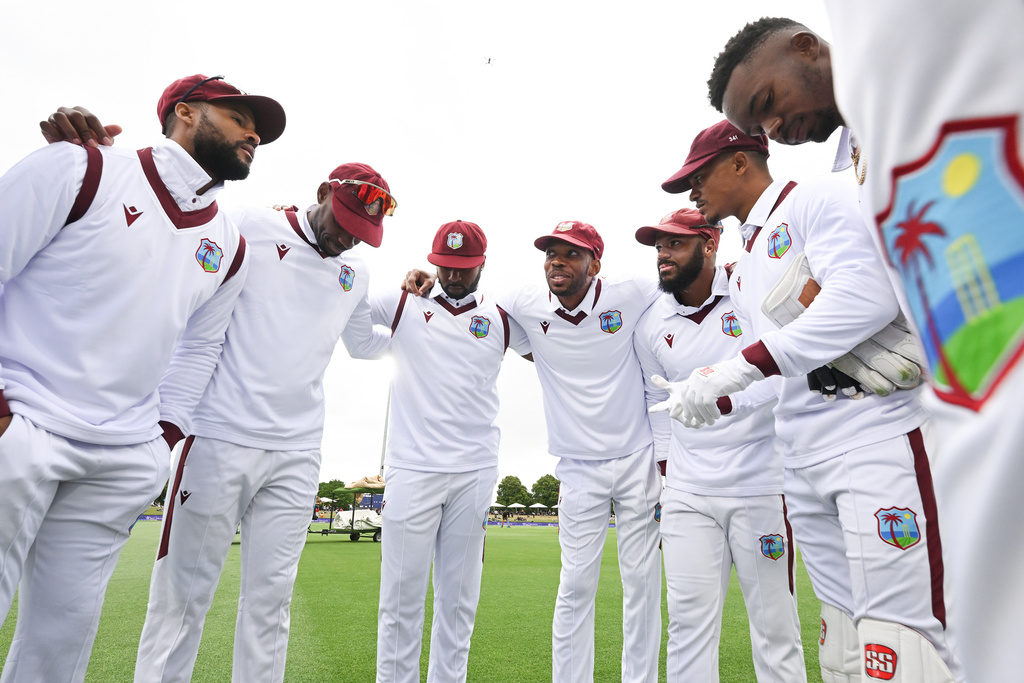 West Indies captain Roston Chase, center, talks to his players ahead of play against New Zealand during their cricket test match in Christchurch, New Zealand, Tuesday, Dec. 2, 2025. (Andrew Cornaga/Photosport via AP)
