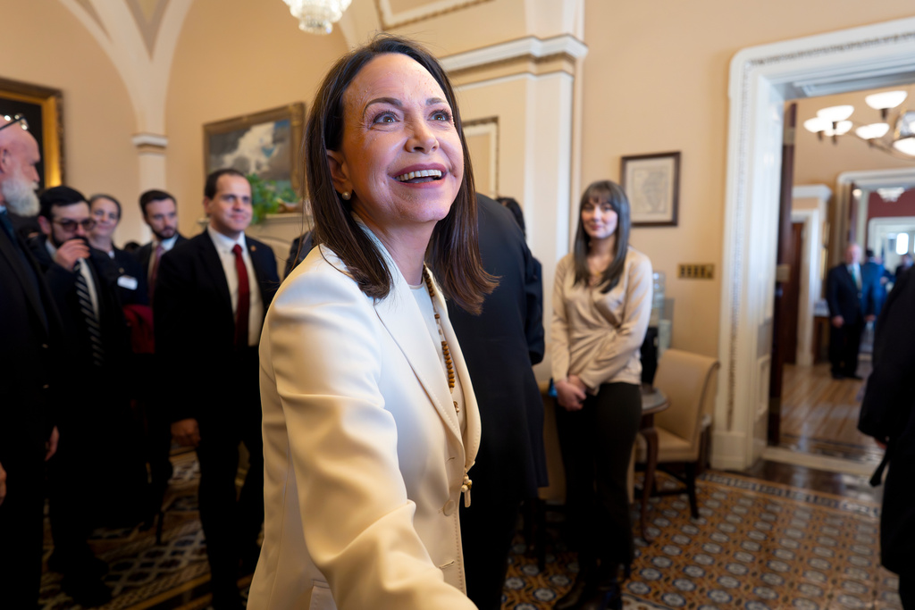 Venezuelan opposition leader Maria Corina Machado is welcomed as she arrives for meetings in the office of Sen. Dick Durbin, D-Ill., the ranking member of the Senate Judiciary Committee at the Capitol in Washington, Thursday, Jan. 15, 2026. (AP Photo/J. Scott Applewhite)