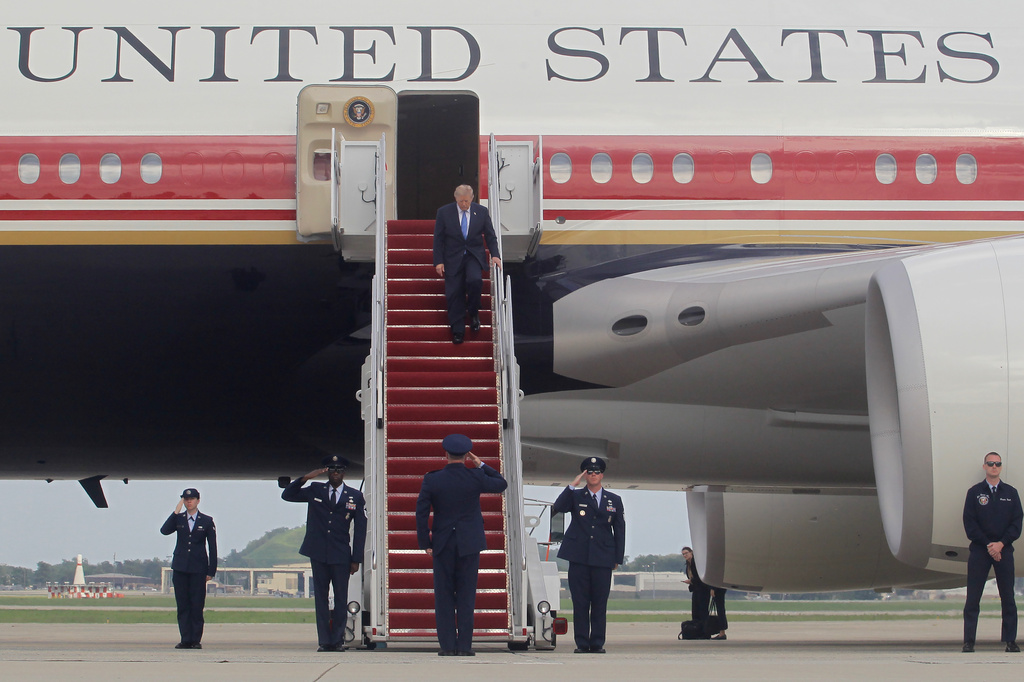 President Donald Trump walks down the stairs of Air Force One upon his arrival at Joint Base Andrews, Md, Friday, Aug. 28, 2026. (AP Photo/Luis M. Alvarez)
