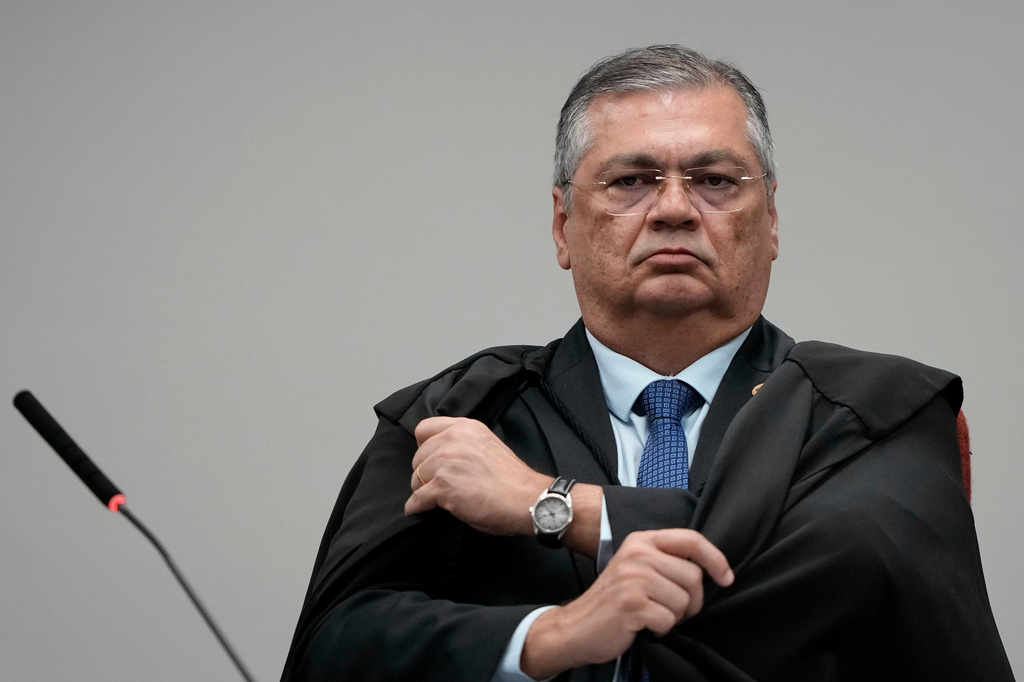 Justice Flavio Dino attends the trial of former Congressman Eduardo Bolsonaro at Brazil's Supreme Court in Brasilia, Tuesday, June 16, 2026. (AP Photo/Eraldo Peres)
