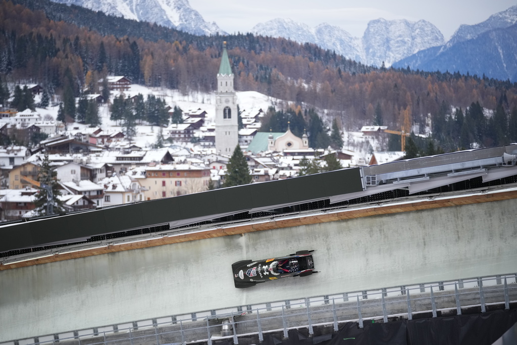 Kaillie Armbruster Humphries of the United States speeds down the course during a women's monobob World Cup race and Olympic test event in Cortina d'Ampezzo, Italy, Saturday, Nov. 22, 2025. (AP Photo/Andrew Medichini)