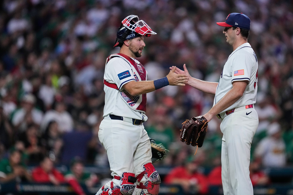 United States pitcher Garrett Whitlock, right, and catcher Cal Raleigh celebrate after the team's victory over Mexico in a World Baseball Classic game, Monday, March 9, 2026, in Houston. (AP Photo/Ashley Landis)