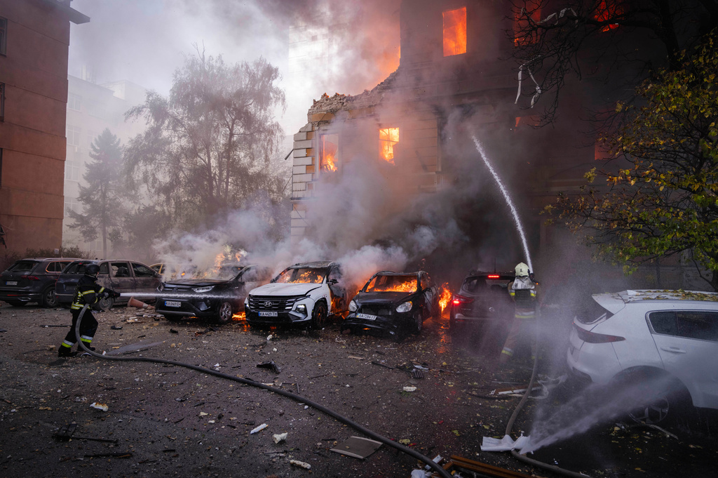 Rescue workers put out a fire at the National Academy of Sciences building damaged after a Russian drone strike in the center of Kyiv, Ukraine, Monday, Sept. 28, 2026. (AP Photo/Dan Bashakov)