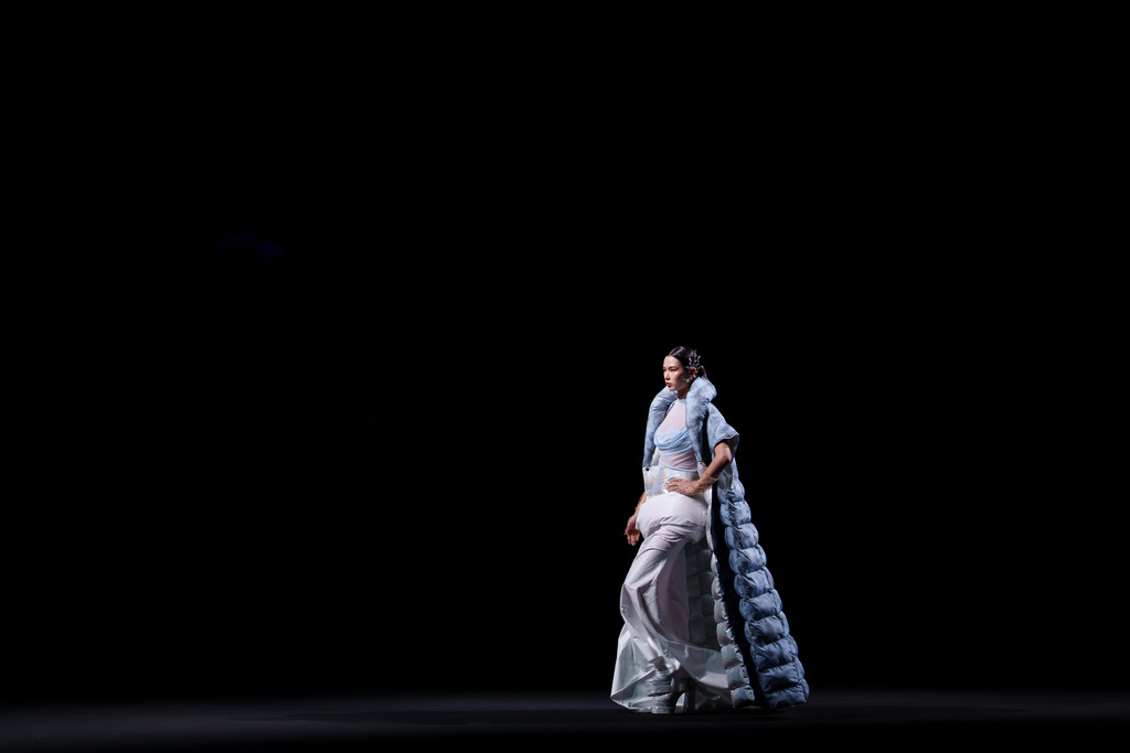 A model wears a creation by Shengze Silk during China Fashion Week (Spring) 2026 in Beijing, China, Tuesday, March 24, 2026. (AP Photo/Vincent Thian)