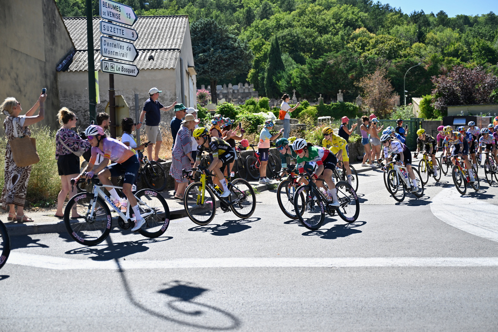 People watch the break away riders during the seventh stage of the Women's Tour de France cycling race (Tour de France Femmes) between La Voulte-sur-Rhone and Mont Ventoux in Malaucene, France, Friday, Aug. 7, 2026. (AP Photo/Philippe Magoni)