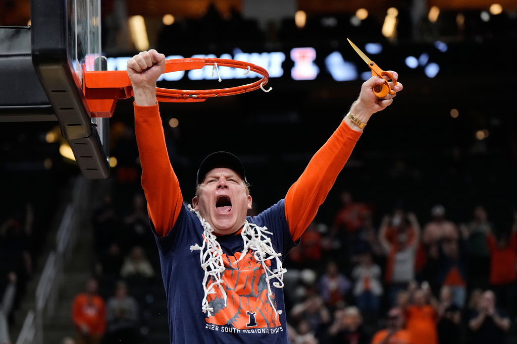 Illinois coach Brad Underwood celebrates after Illinois beat Iowa in an Elite Eight game in the NCAA college basketball tournament Saturday, March 28, 2026, in Houston. (AP Photo/Ashley Landis)
