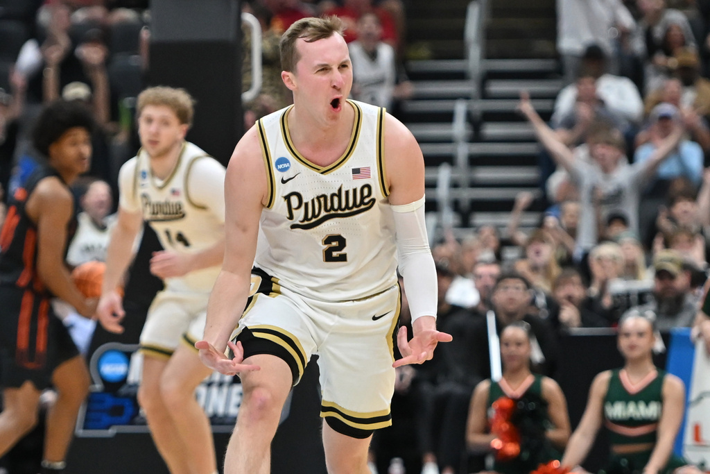 Purdue's Fletcher Loyer (2) celebrates during the first half in the second round of the NCAA college basketball tournament against Miami, Sunday, March 22, 2026, in St. Louis. (AP Photo/Ali Overstreet)