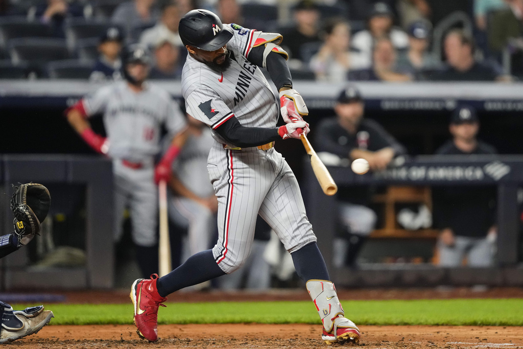 Minnesota Twins' Byron Buxton hits a double during the fourth inning of a baseball game against the New York Yankees, Wednesday, Aug. 13, 2025, in New York. (AP Photo/Yuki Iwamura)