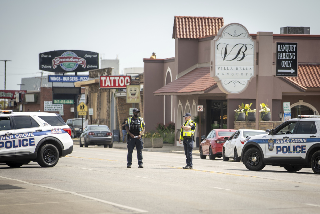 Law enforcement personnel investigate after the Department of Homeland Security said an Immigration and Customs Enforcement agent fatally shot a man in the Franklin Park suburb of Chicago on Friday, Sept. 12, 2025. (Candace Dane Chambers/Chicago Sun-Times via AP)
