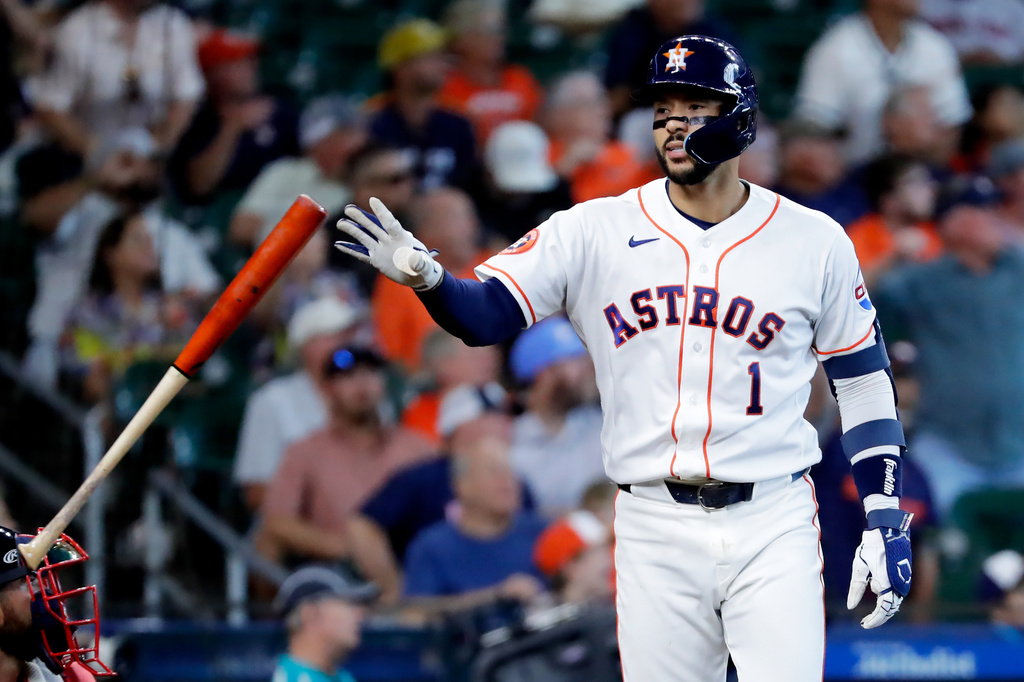 Houston Astros' Carlos Correa flips his bat before rounding the bases on this three-run home run against the Boston Red Sox during the fifth inning of a baseball game Wednesday, April 1, 2026, in Houston. (AP Photo/Michael Wyke)