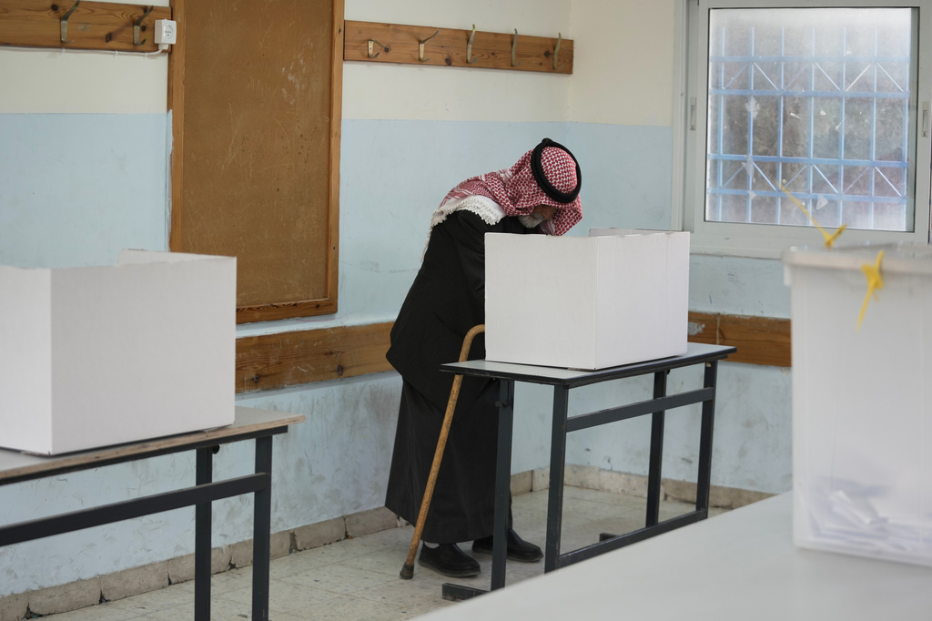 A Palestinian man votes in local elections, the first in two decades in Gaza and the first in the occupied West Bank since the start of the Israel-Hamas war in Al-Ubaidiya, West Bank, Saturday, April 25, 2026. (AP Photo/Mahmoud Illean)