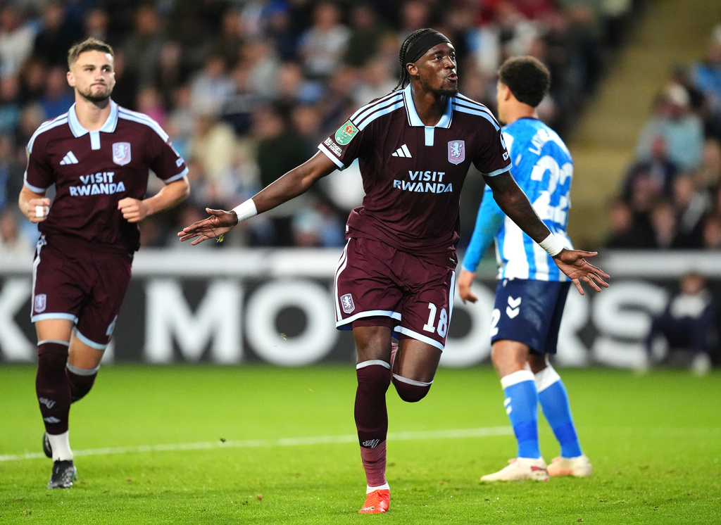 Aston Villa's Tammy Abraham, centre, celebrates scoring their side's third goal during the English League Cup third round soccer match between Coventry City and Aston Villa in Coventry, England, Wednesday, Sept. 16, 2026. (Nick Potts/PA via AP)