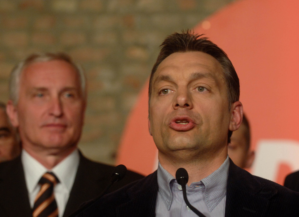 FILE -Viktor Orban, chairman of the senior opposition party, the Fidesz - Hungarian Civic Alliance, right, speaks following the first round of the parliamentary elections in Hungary in Budapest, April 9, 2006. At left is deputy prime minister candidate of the Fidesz, Istvan Mikola. (AP Photo/MTI, Szilard Koszticsak, File)