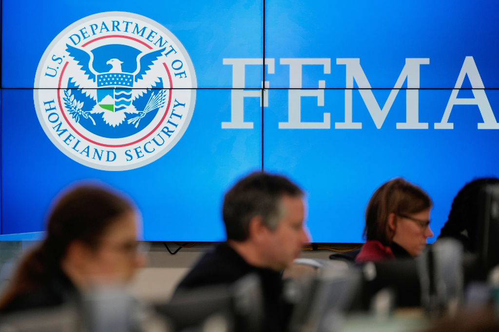 FILE - People work at the Federal Emergency Management Agency headquarters in Washington, Jan. 24, 2026. (AP Photo/Julia Demaree Nikhinson, File)
